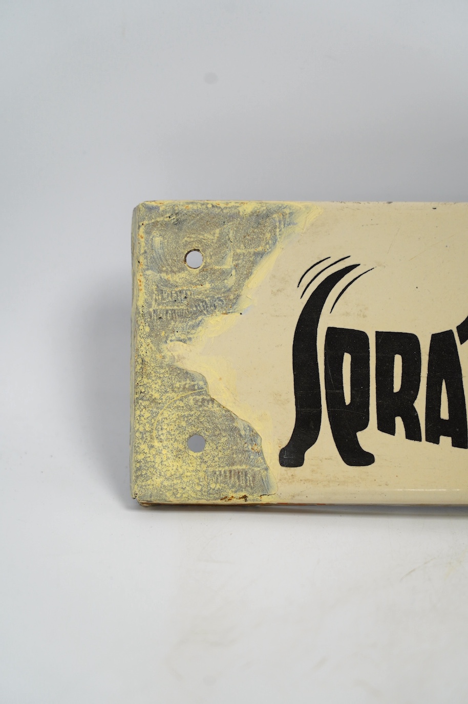 A vintage Spratt’s 'Three Terrier' enamel advertising sign, 51cm wide, 11cm high. Condition - poor to fair